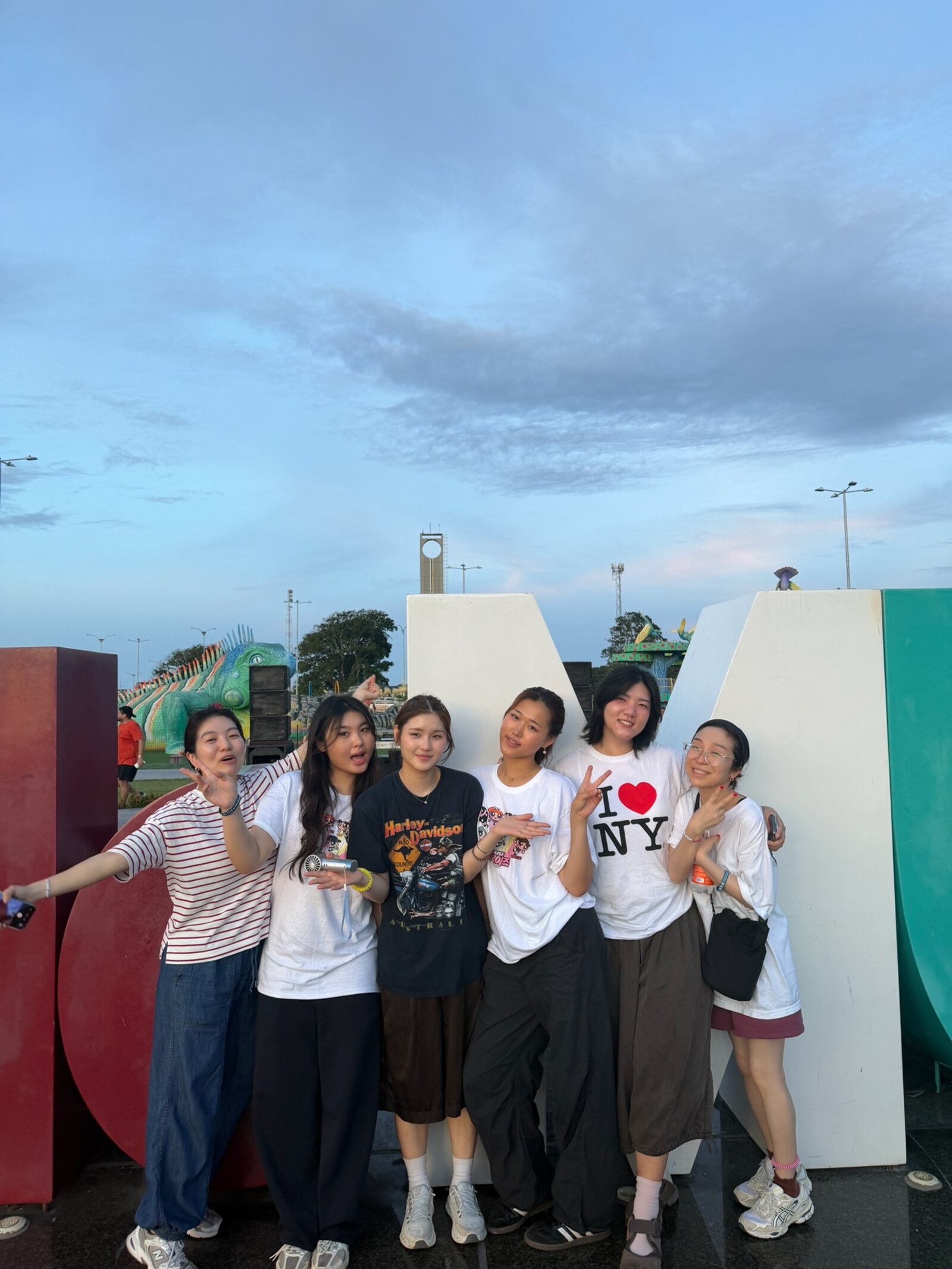 Grace with friends at the colorful city letters in Brazil