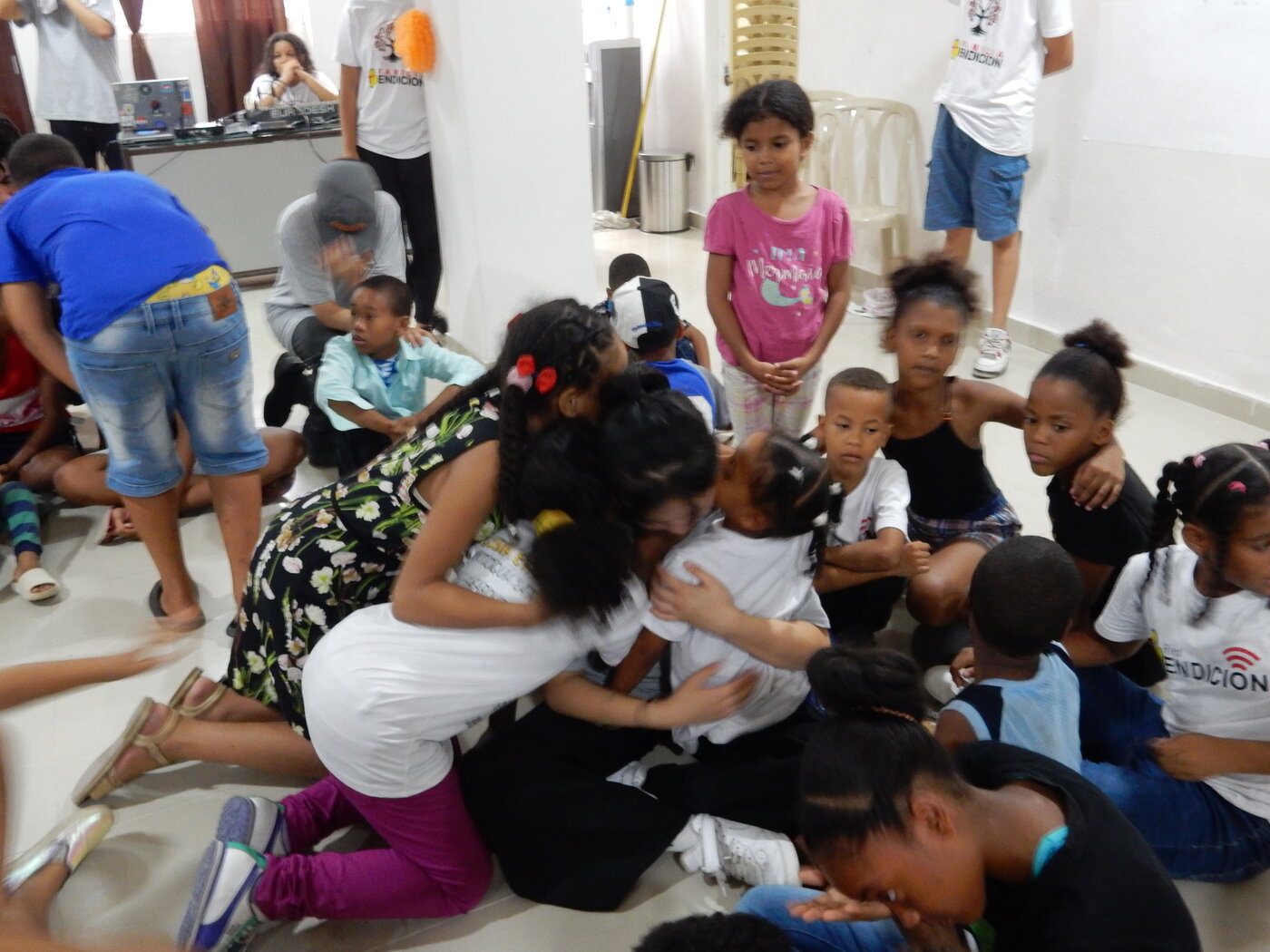 A group hug with children during the Dominican Republic service trip