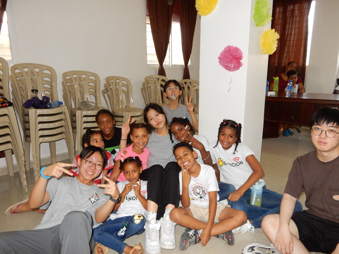 Grace with children from the community on a return trip to the Dominican Republic