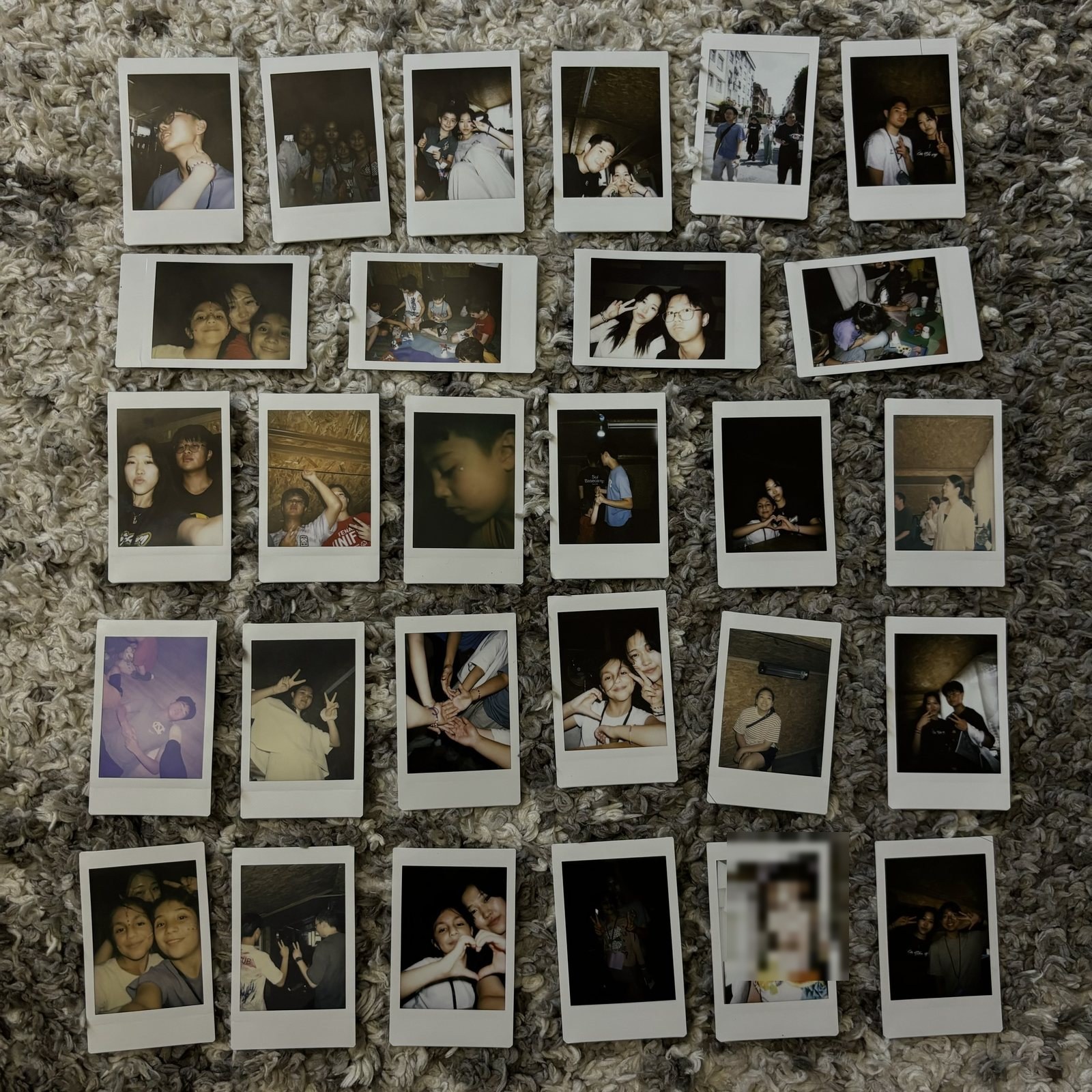 Polaroids from the Turkey trip laid out on a carpet