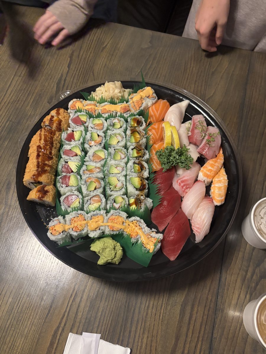 A large sushi and sashimi platter seen from above