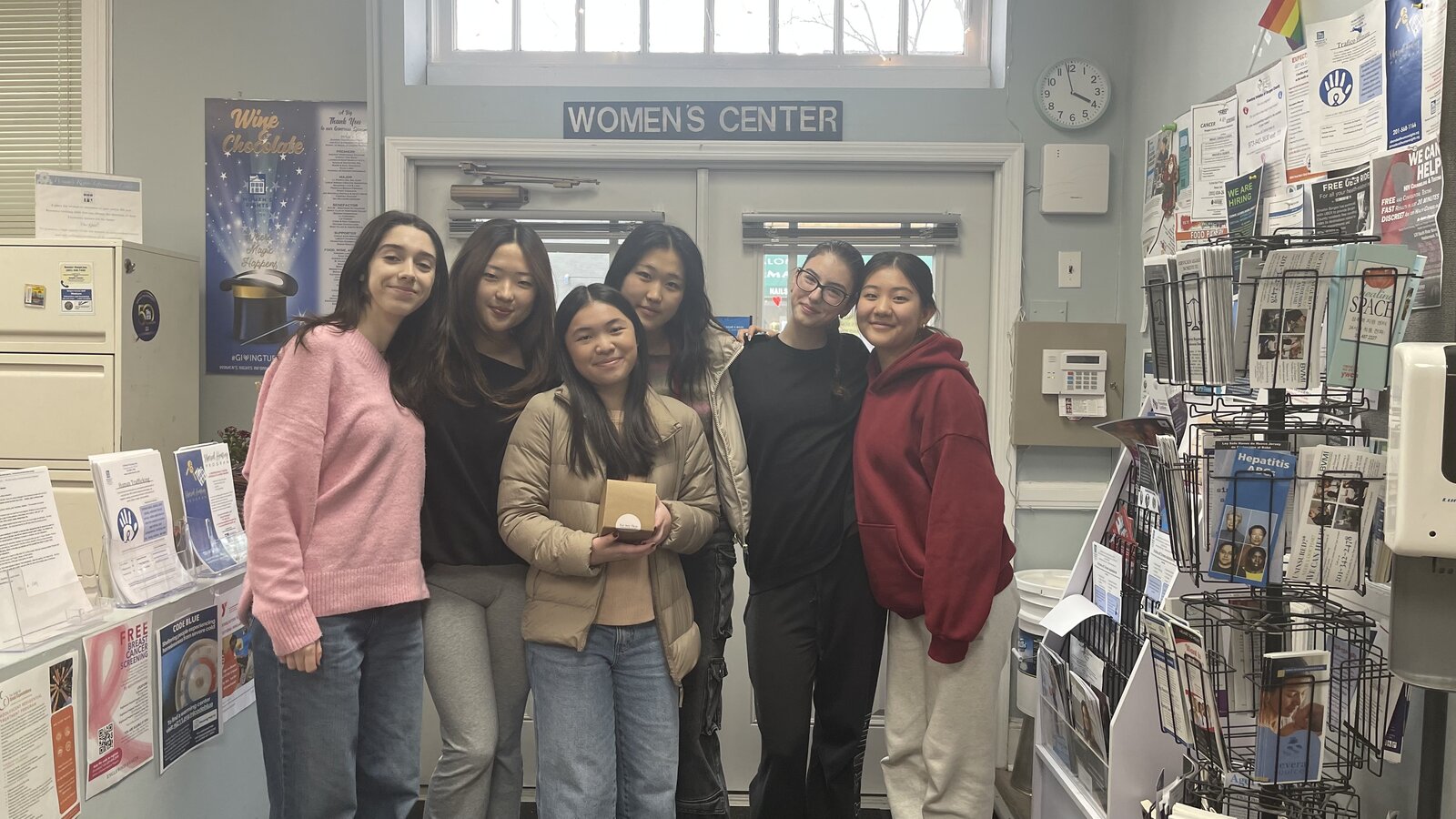 The For Her Flow team dropping off collected donations at The Women's Center